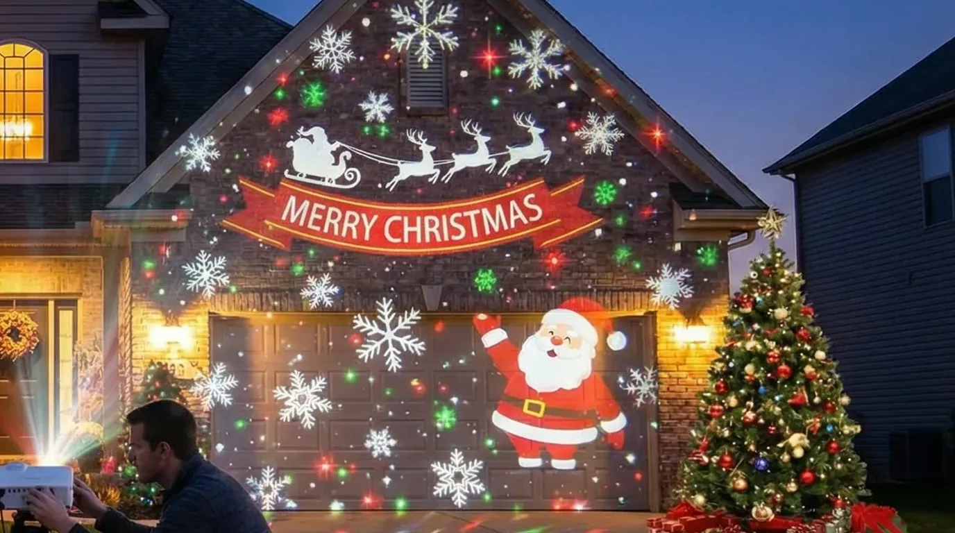 Christmas projection mapping on a garage door at night: Santa, snowflakes and a decorated tree projected onto the door panel while the surrounding house stays dark